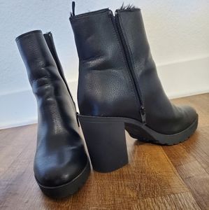 Black H&M women Faux leather and fur lined boots.